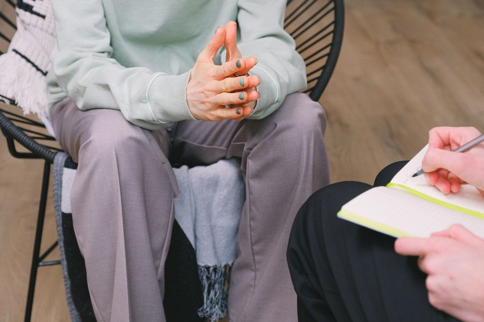 Two people discussing support needs during a private consultation